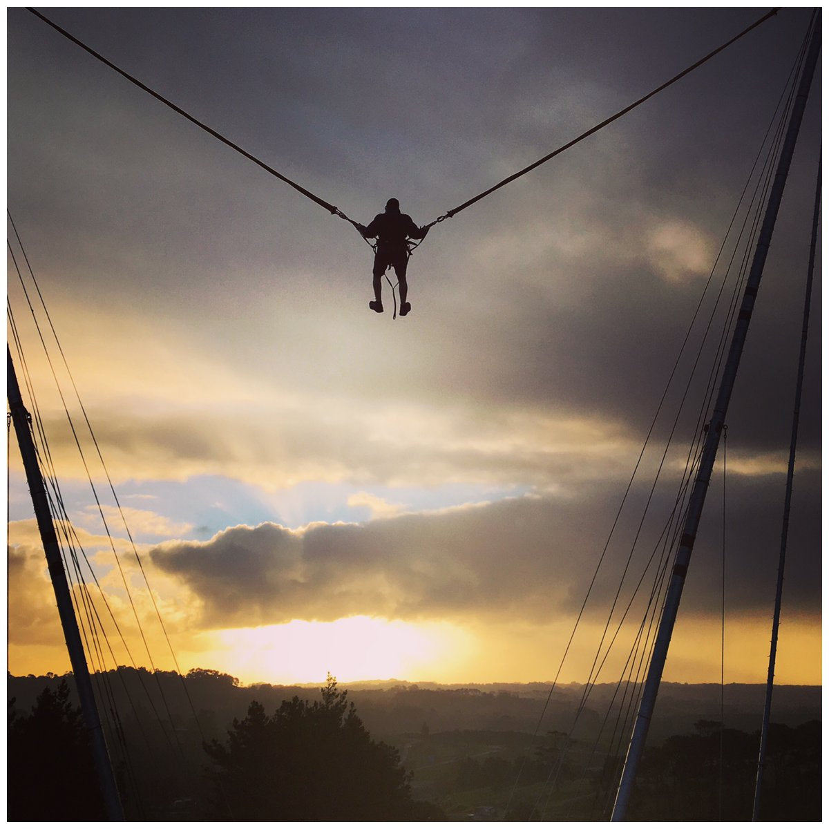 Man jumping high in sunset