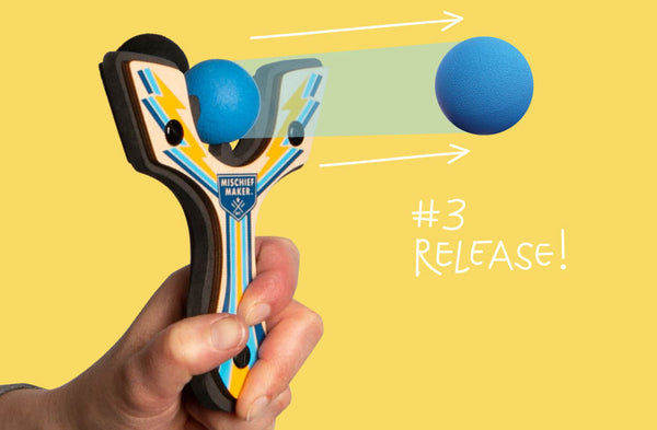 Step 3 Release the hammer on the toy slingshot and send ball flying