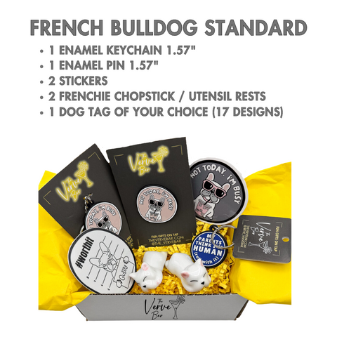 frenchie gift box containing enamel pin, enamel keychain, rubber dog tag, stickers. and Frenchie Utensil rests