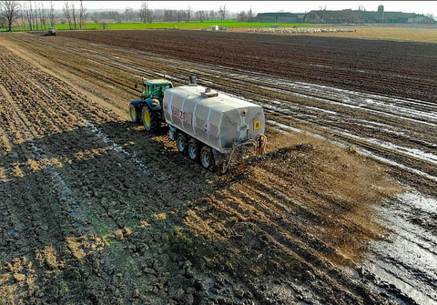Tractor fertilizing a field and possibly contaminating drinking water