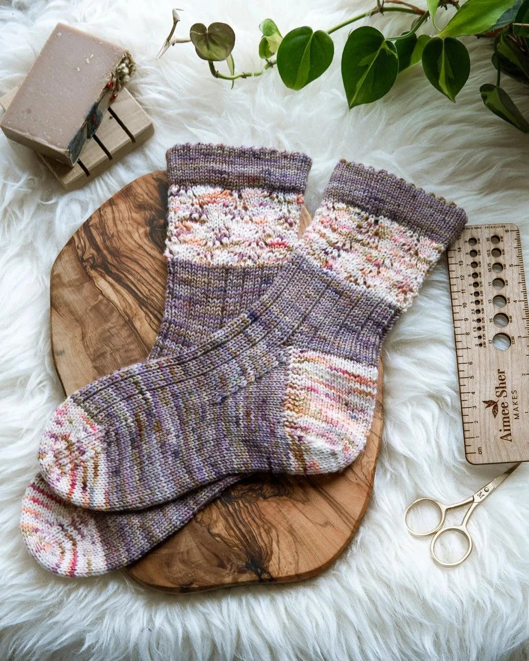 Image of purple and cream socks with a lace section.