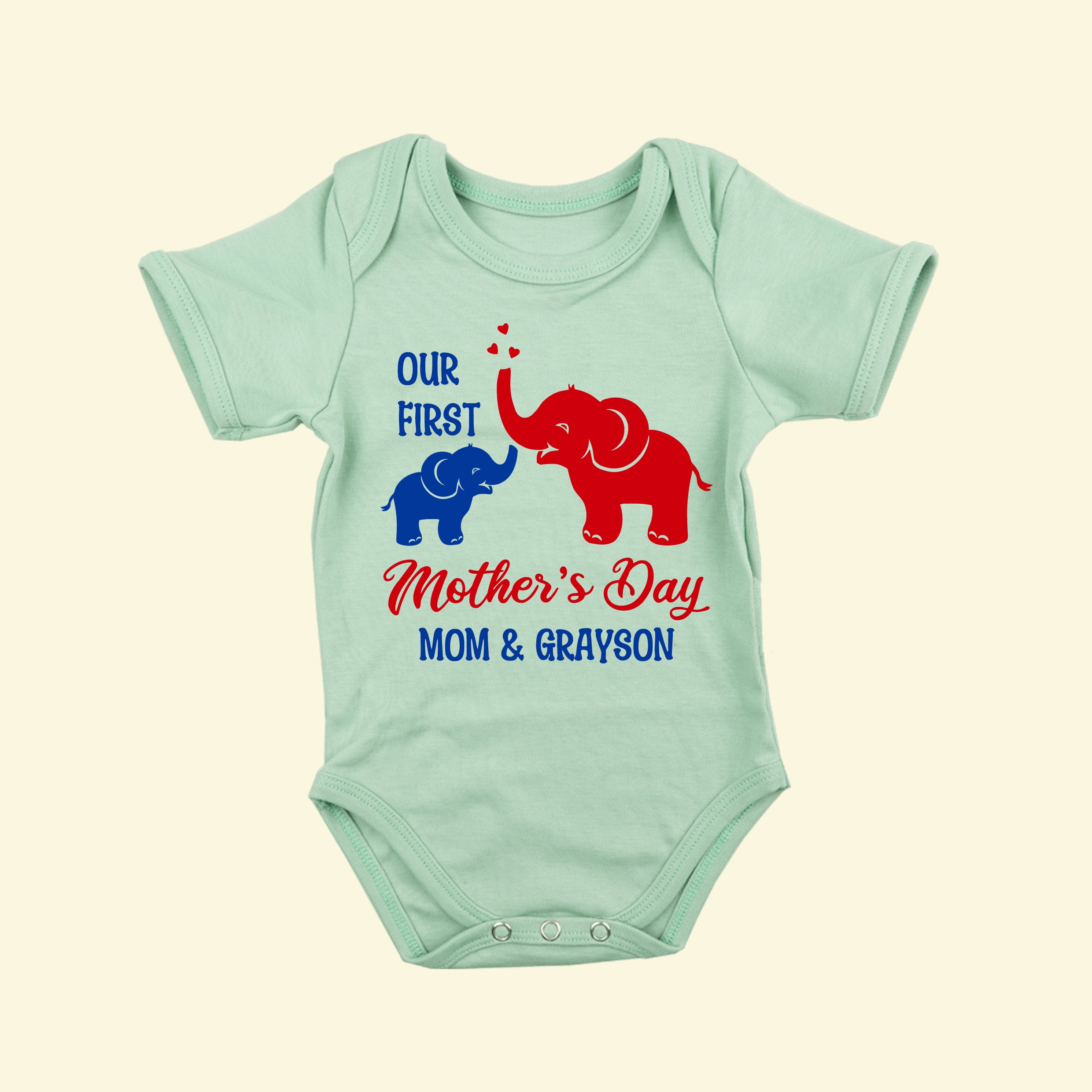  Light Green short sleeve babygrow with design of mummy and baby elephant in two print colours - text reads our first, Mother's Day, Mom & Grayson