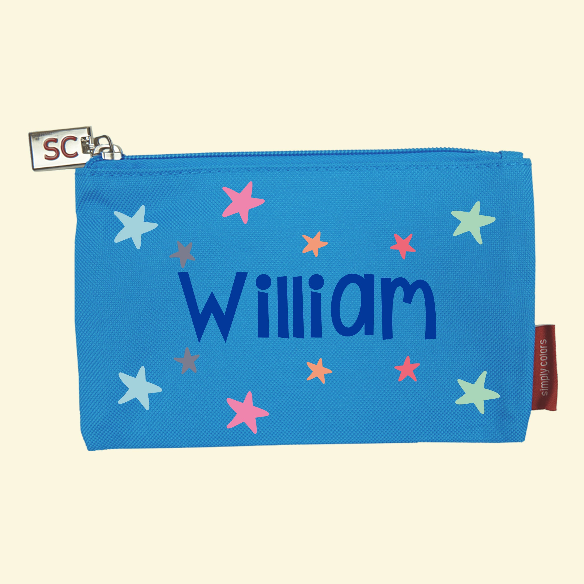 Aqua blue pencil case printed with a colour star design with the name William in the center.
