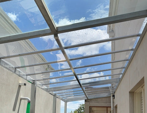 Pergola with glass like roofing
