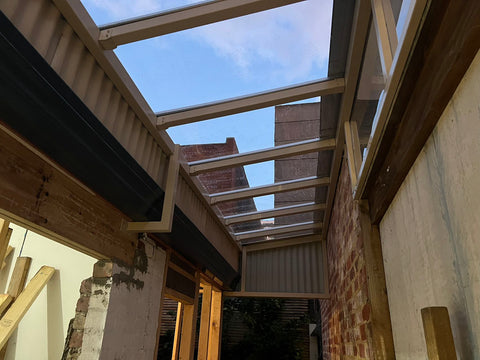 pergola with clear glass like roof