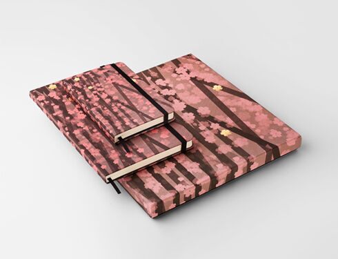 An image of Kosuke Tsumura's Moleskine notebook, with a soft pink hue and soft silhouettes of tree-like shapes