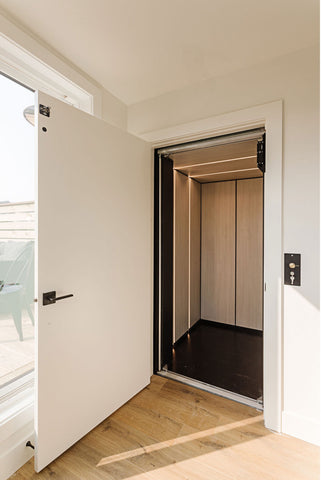 Wood panel elevator with smart lights integrated into walls