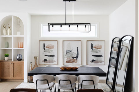 Kitchen with three paintings on wall