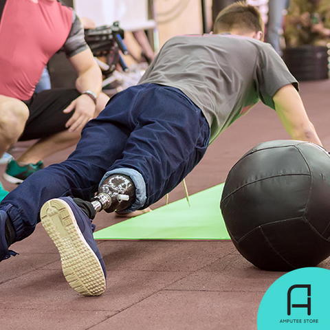 An individual with lower-limb amputation performs the plank with his prosthesis.