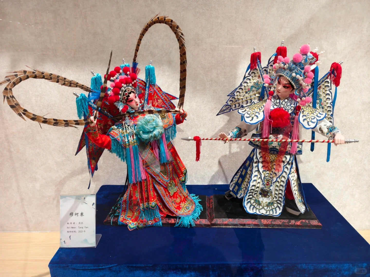 Handmade Peking Opera Chinese silk doll of Mu Guiying, warrior heroine, in embroidered armor with phoenix headdress, crafted using非遗 techniques.