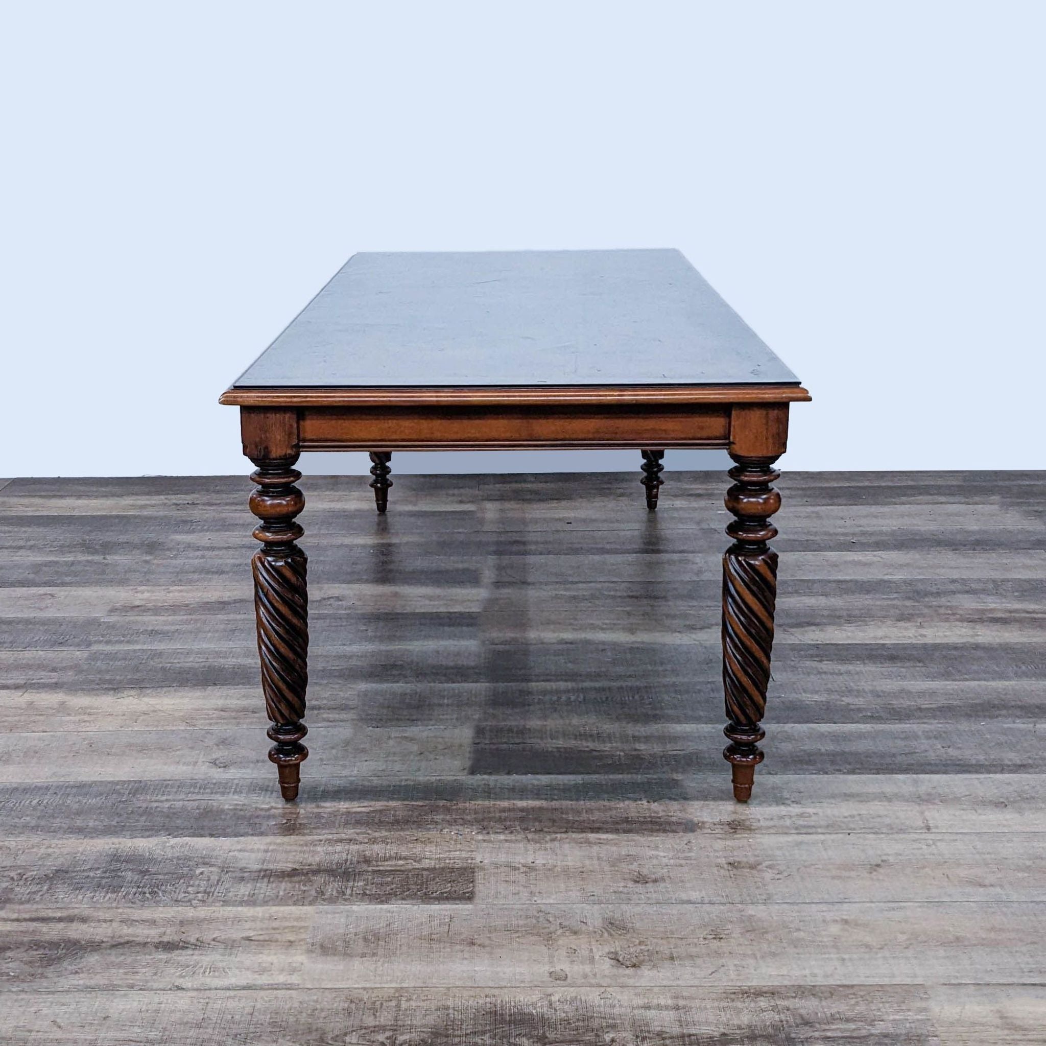 Extendable dining table by Reperch with twisted legs in Early American Harvest Style, shown not extended.