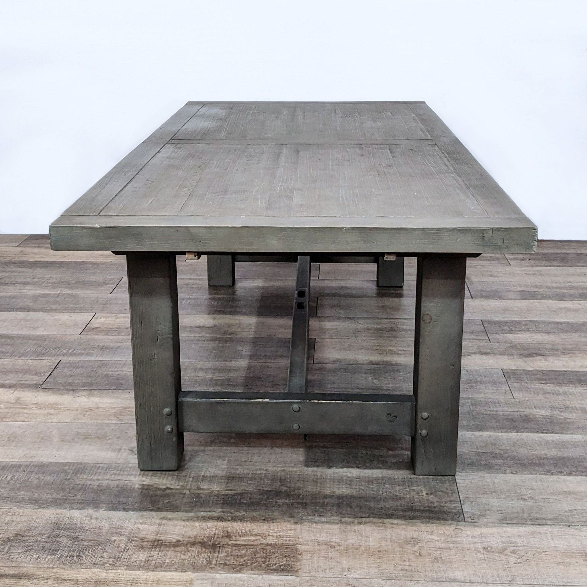 Reperch brand wooden dining table with rustic veneer finish and robust trestle base, farmhouse design.