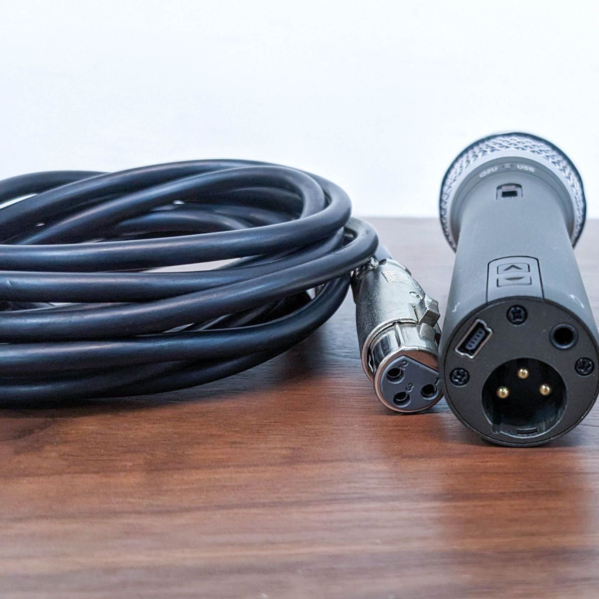 2. Close-up of the Samson Q2U microphone and cable connectors, highlighting its dual output options for high-quality sound capture.