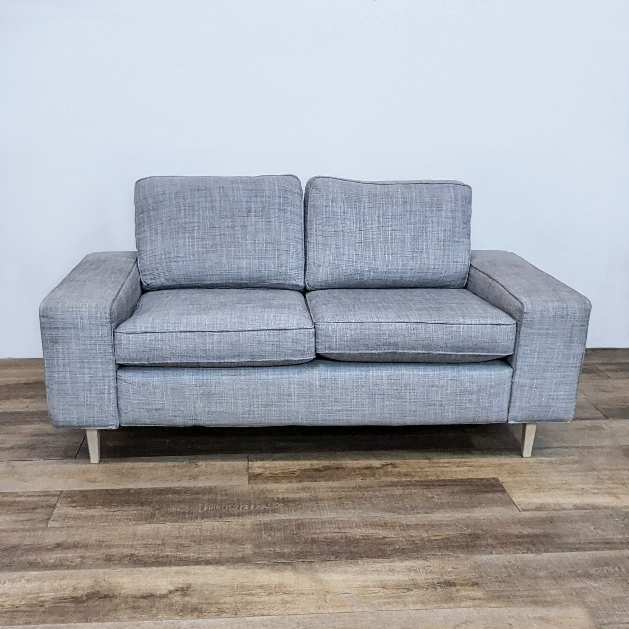 Alt text 1: IKEA 3-seat compact sofa with square arms and light finish feet, upholstered in a gray textured fabric.