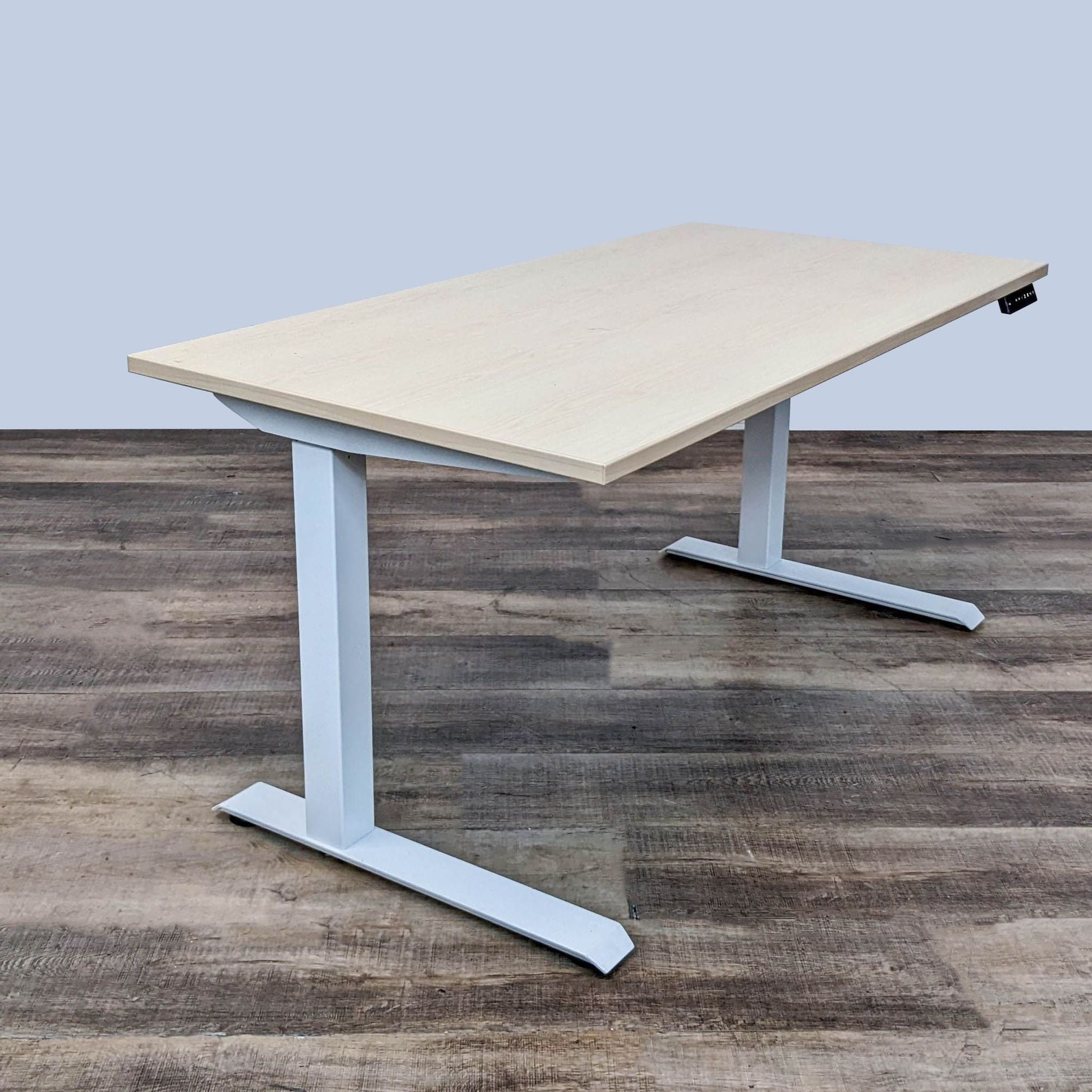 Ergonomic electric standing desk by AMQ, featuring adjustable height controls and a stylish oak finish.
