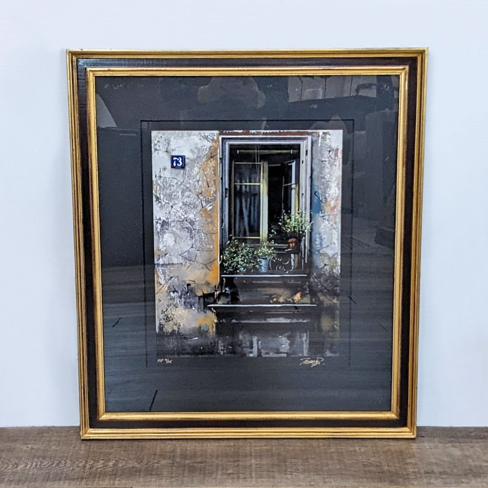 Alt text 1: "Limited edition serigraph print of a weathered building window numbered 9/25 by Thomas Pradzynski, framed in gold, from Reperch."