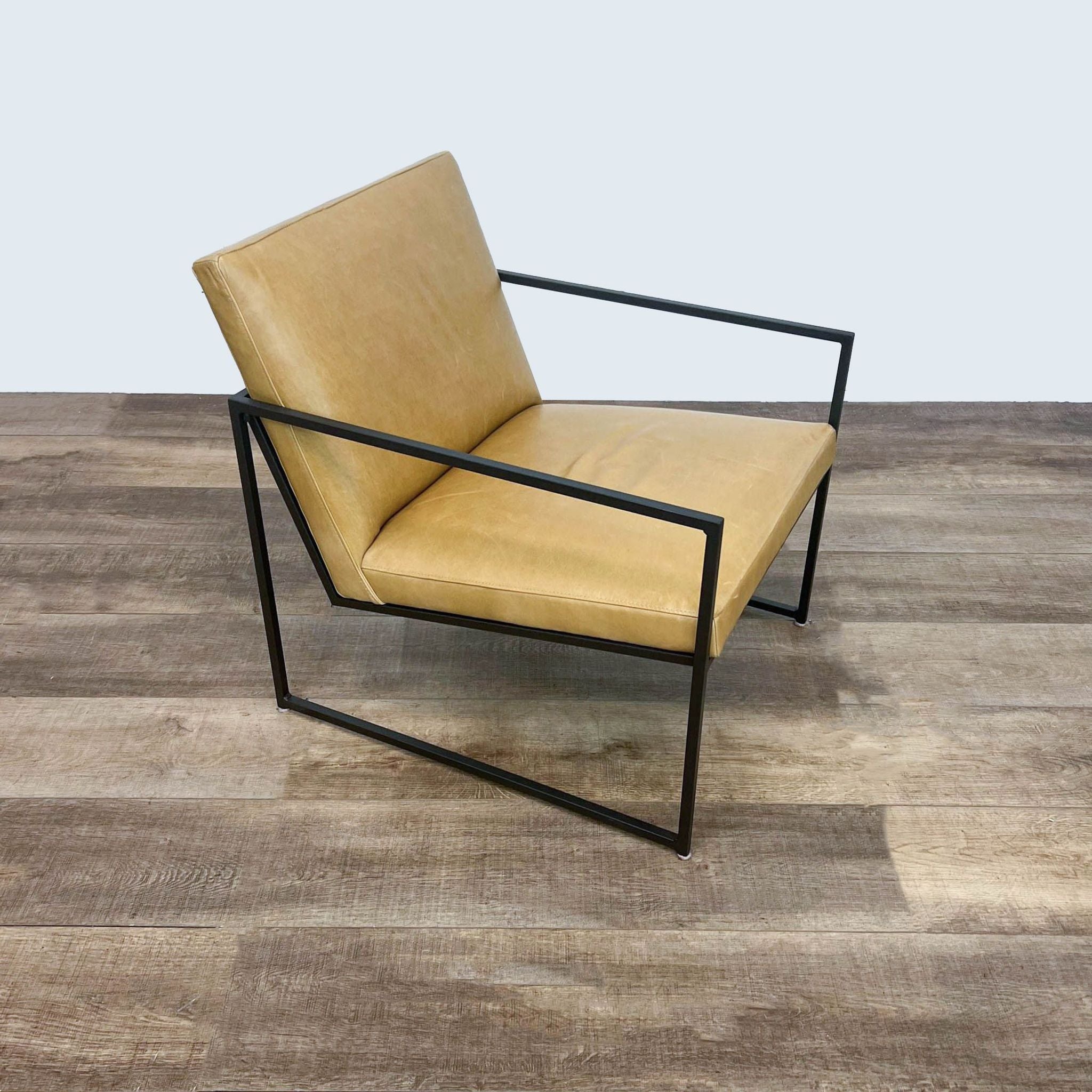 Minimalist Novato lounge chair by Room & Board featuring luxurious leather upholstery and a sleek steel frame.