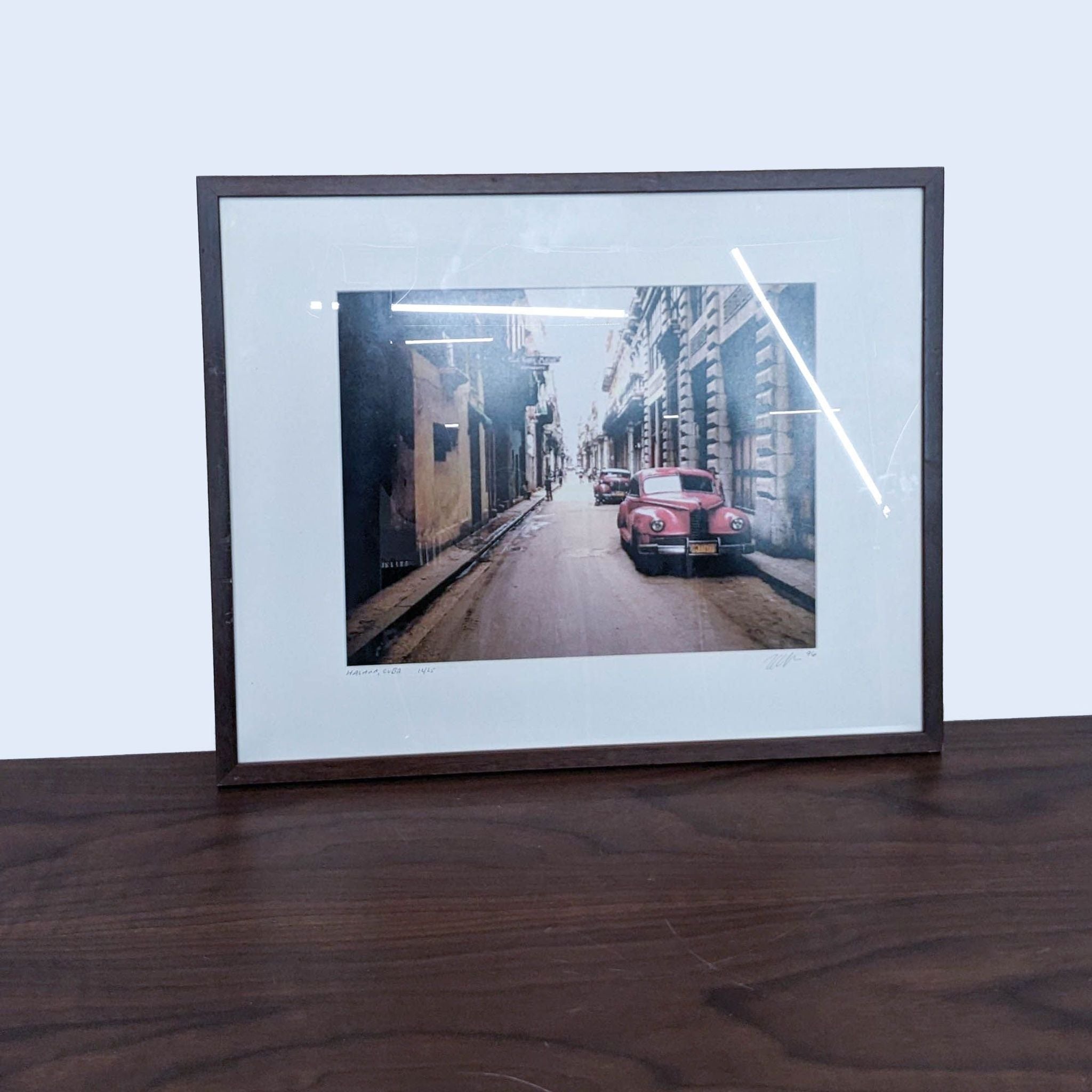 2. Reperch-brand art print featuring a vintage red car in an old Havana alley, limited edition numbered 12/25, framed.
