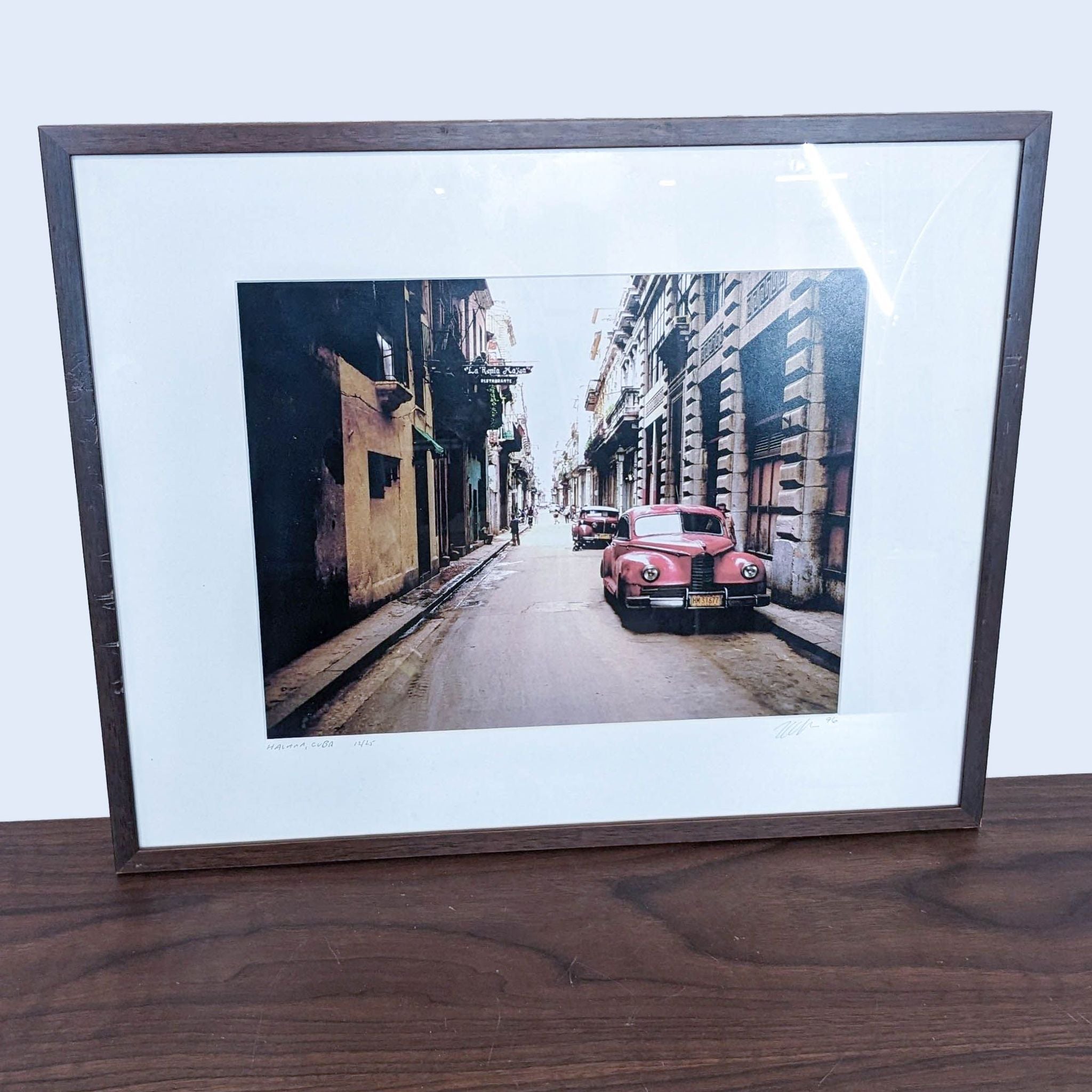 1. Limited edition framed print of a classic red car on a street in Havana, numbered 12/25 by Reperch.