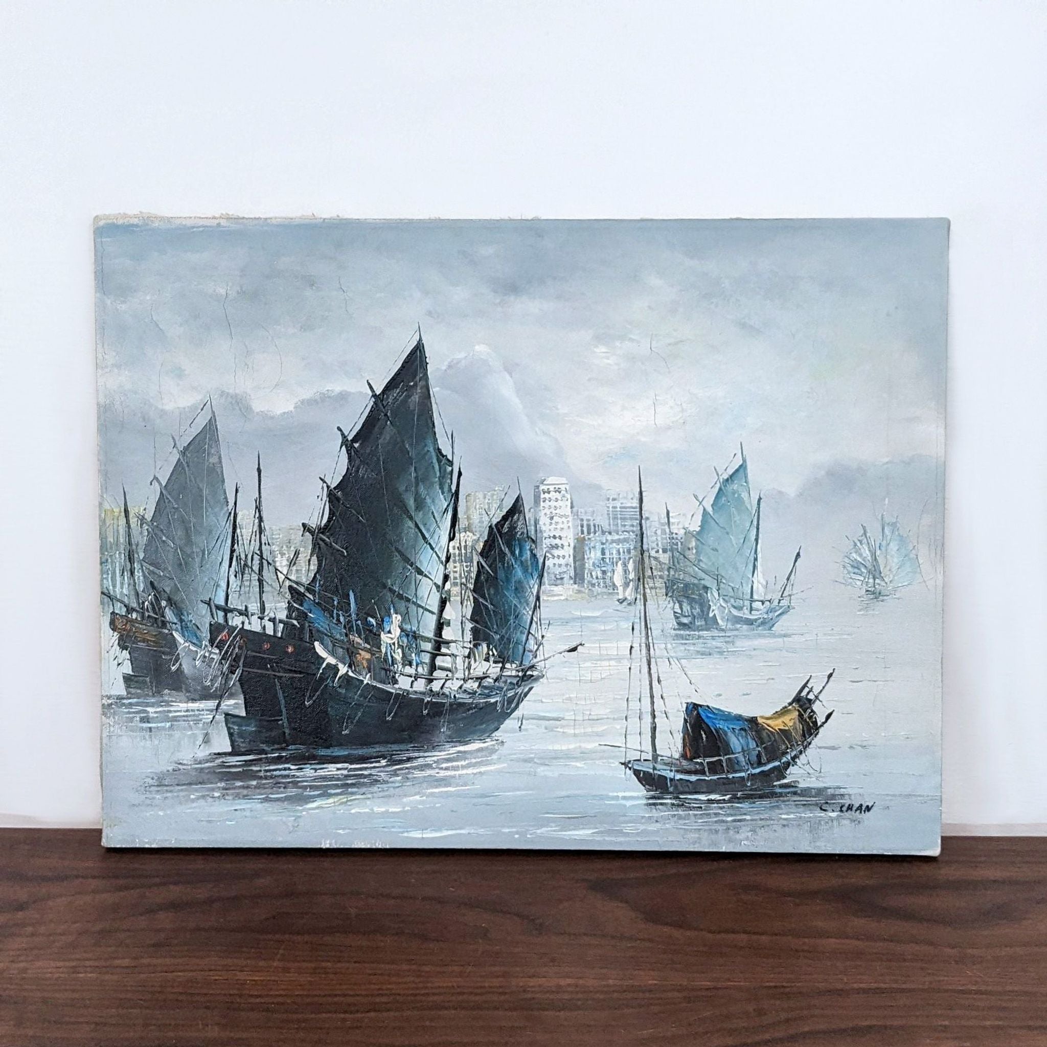 Reperch painting depicting sailboats in harbor with foggy cityscape in background, artwork signed.
