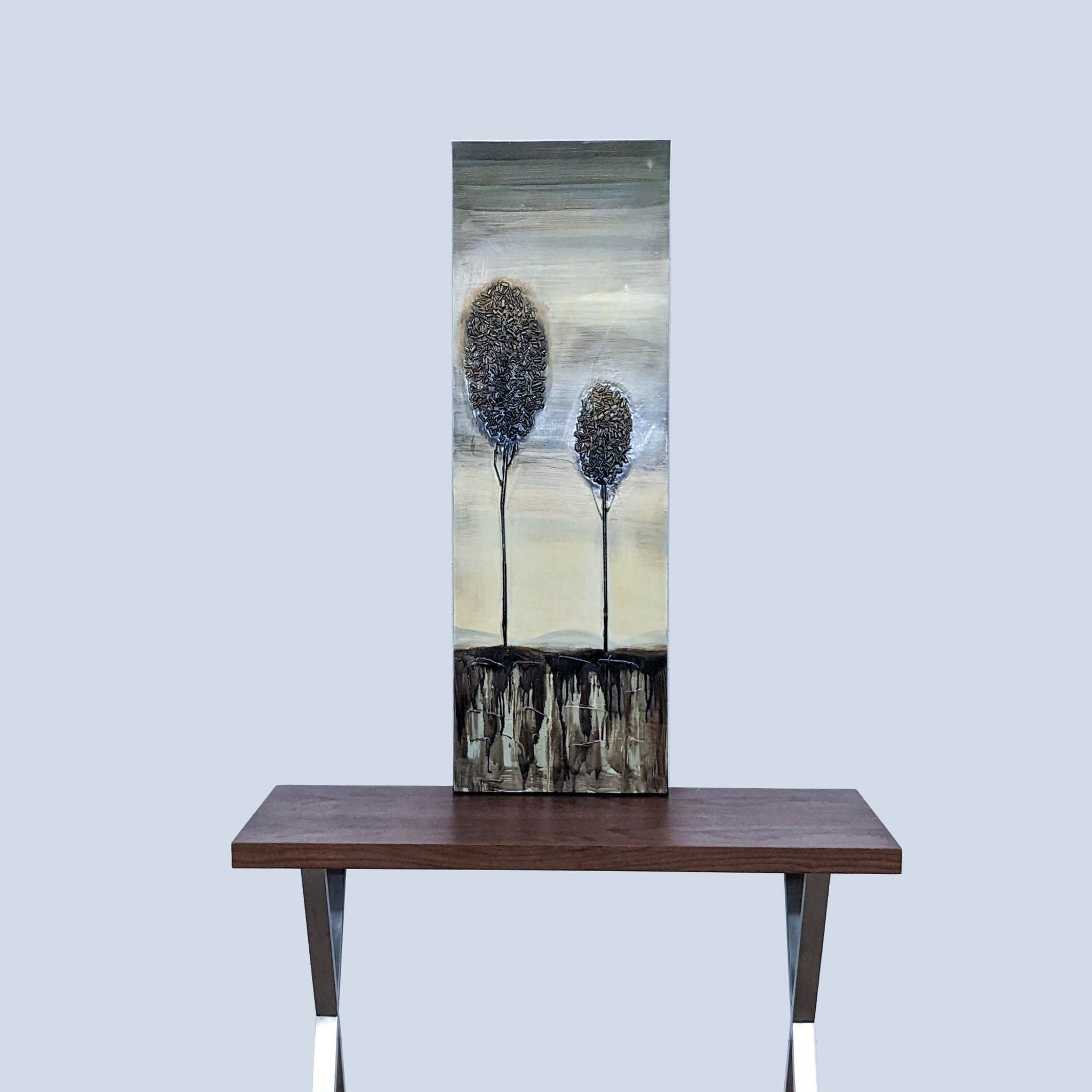 Alt text 1: Reperch mixed media botanical art print depicting two textured trees on canvas, displayed on wooden table against neutral background.