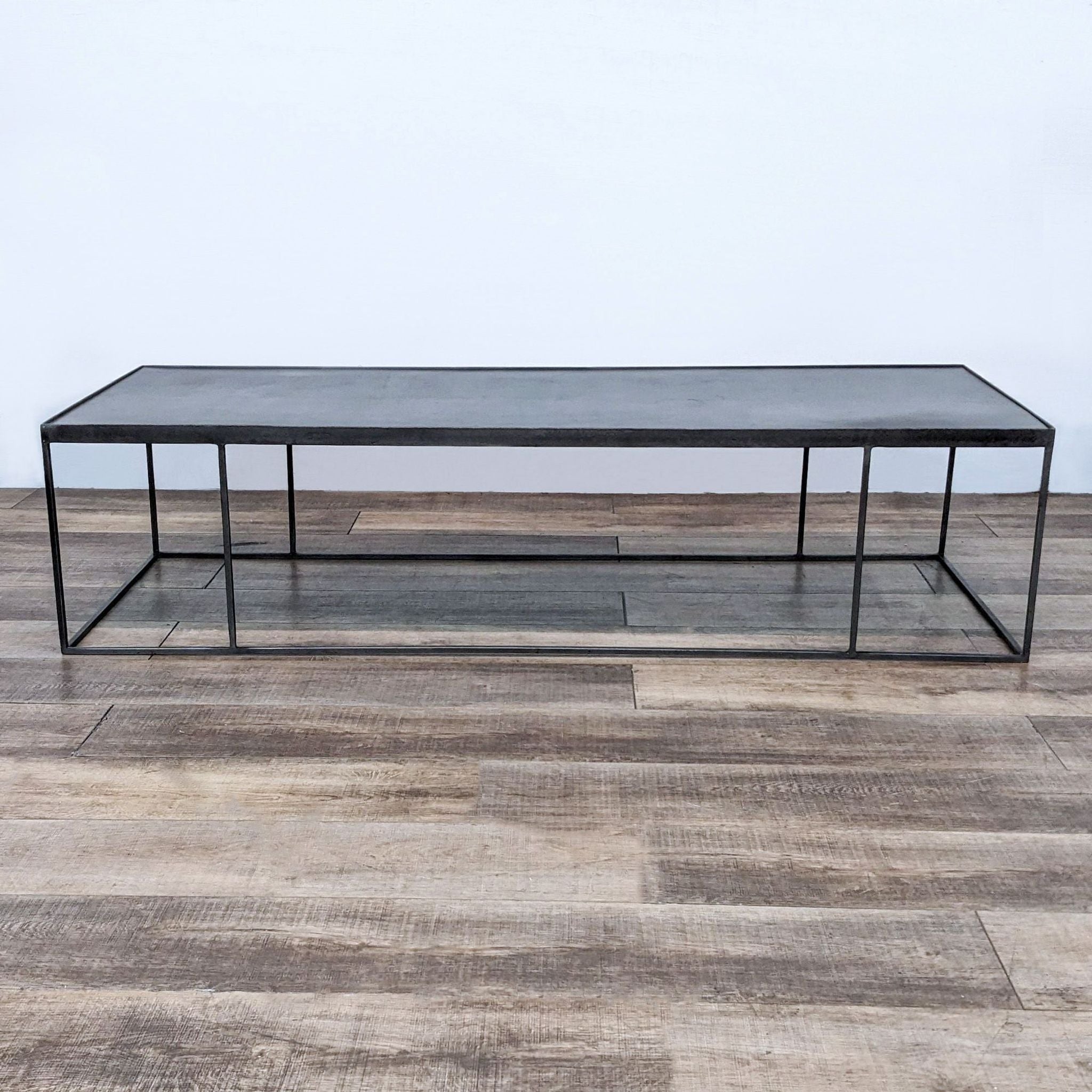 Reperch brand coffee table with a minimalist metal frame and a grey top against a neutral background.