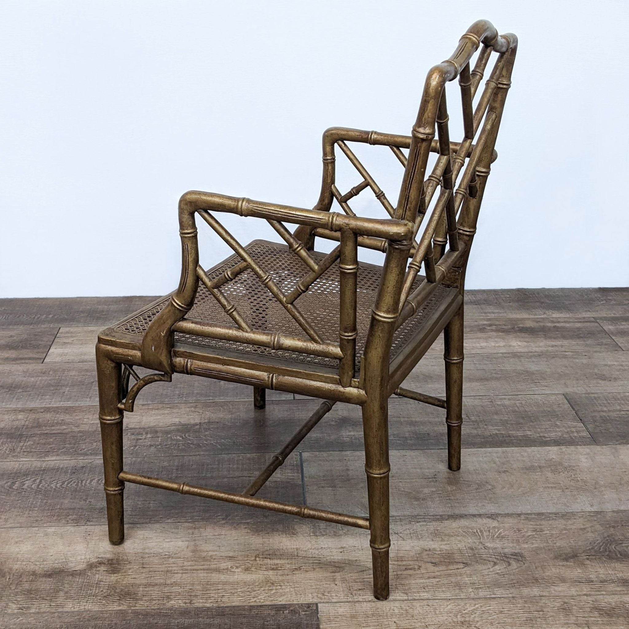 Reperch dining chair featuring an exotic bamboo design with a comfortable rattan weave seat, pictured from an angle.