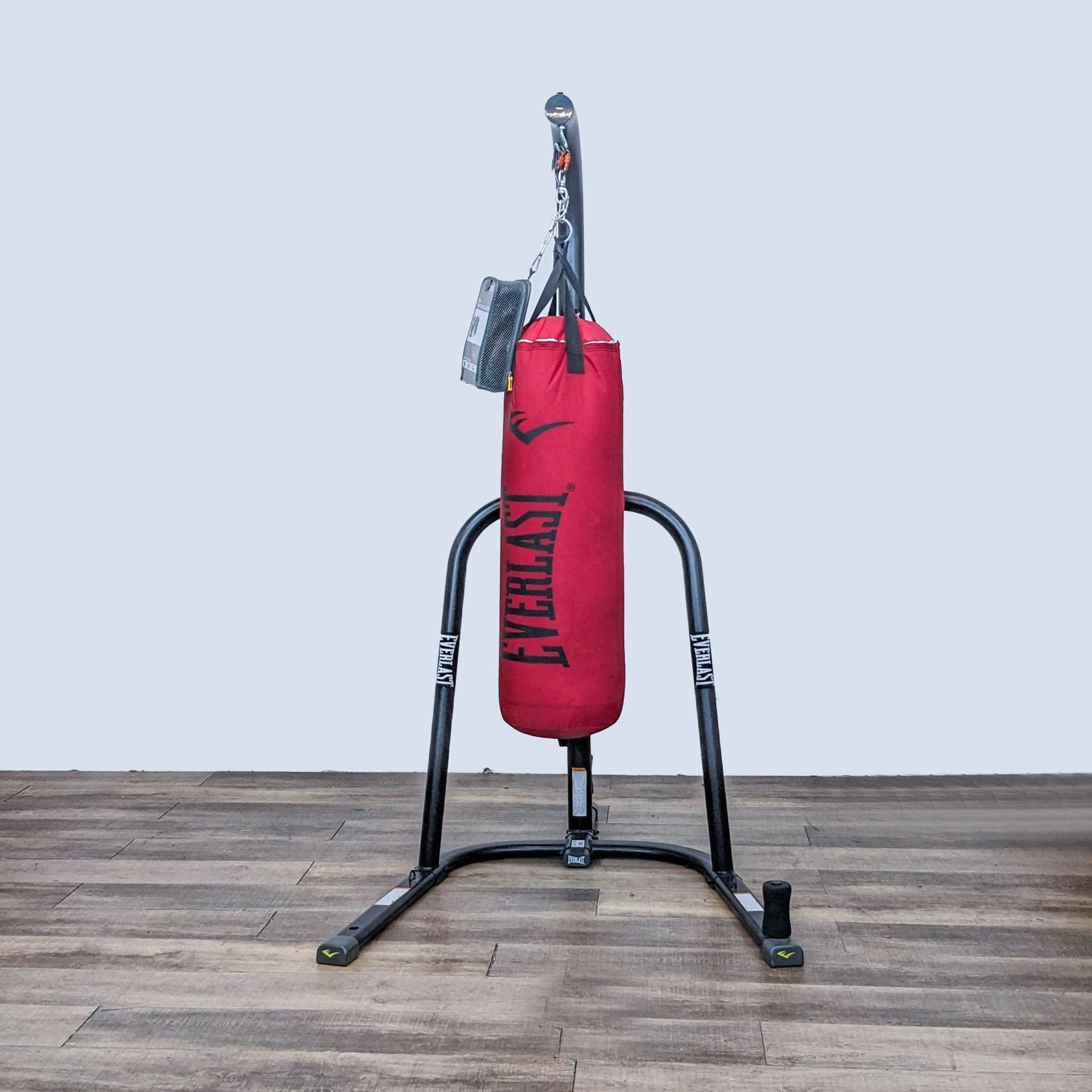 Everlast free-standing heavy bag for boxing and MMA with a solid frame and red durable punching bag, ideal for home or gym.