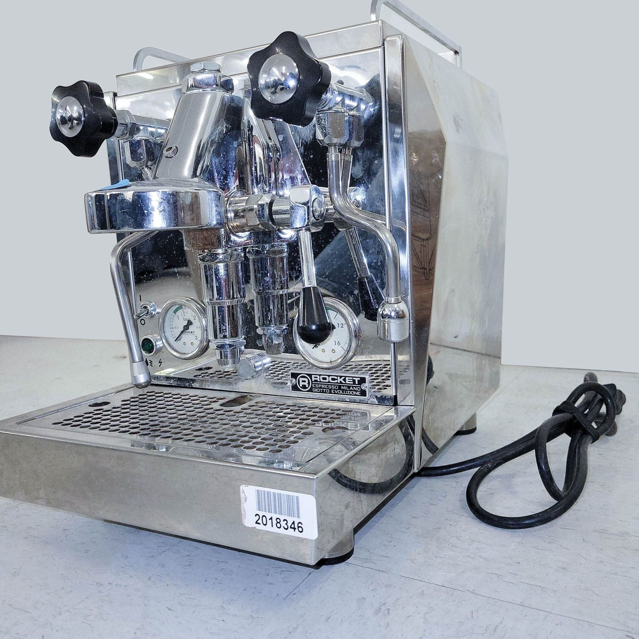 Side view of a sleek Rocket Espresso coffee maker featuring pressure gauge and stainless steel design.