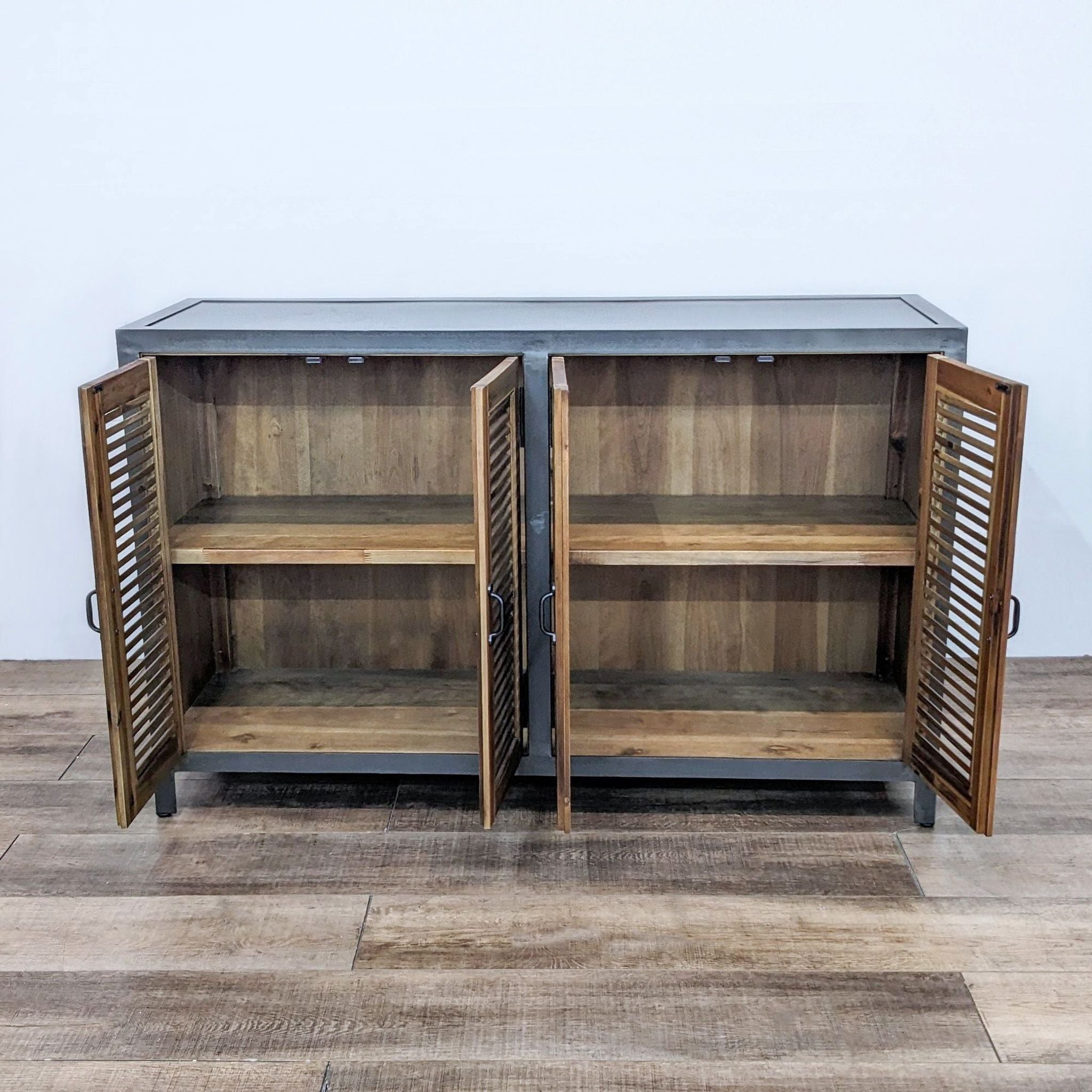 World Market credenza with open louvered doors revealing interior shelves, metal and wood design.