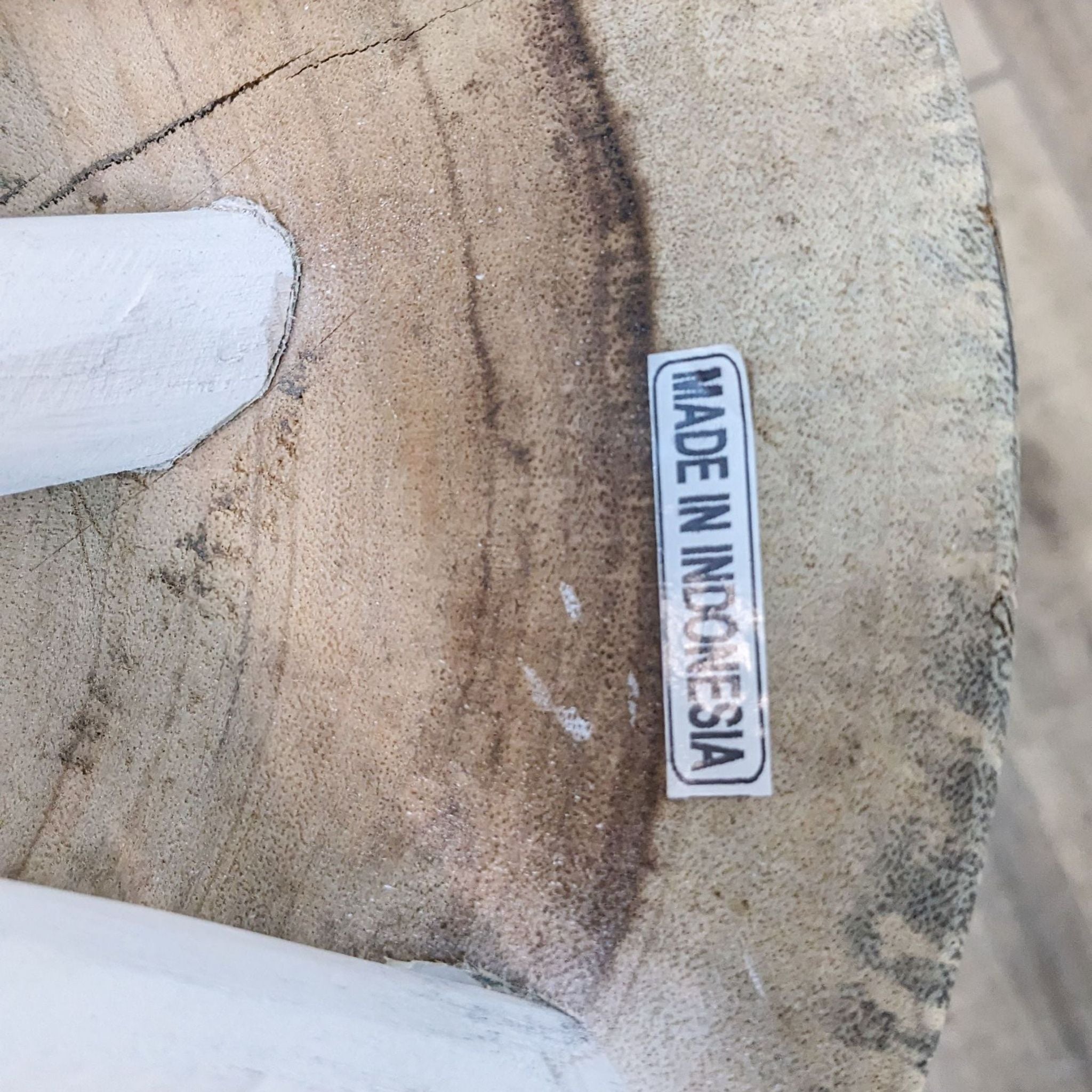 2. Close-up of a Reperch side table with a rustic wooden top and a "Made in Indonesia" label, highlighting the table's unique branch-like legs.