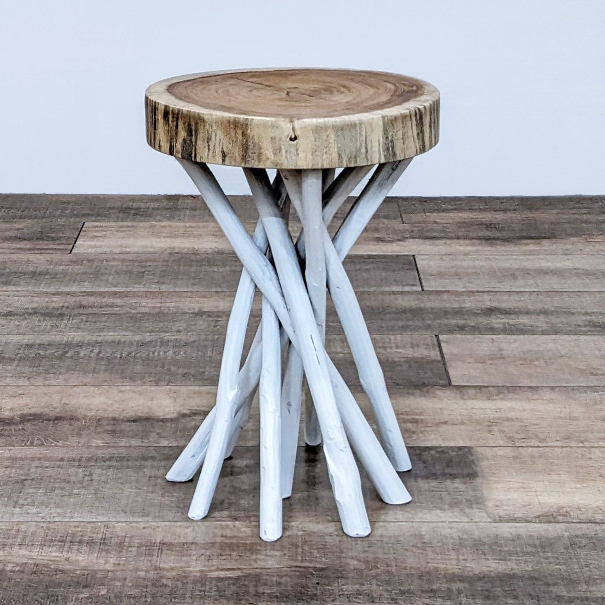1. Reperch brand side table featuring a natural wooden top with a multi-branch base painted in white, situated on a wooden floor.