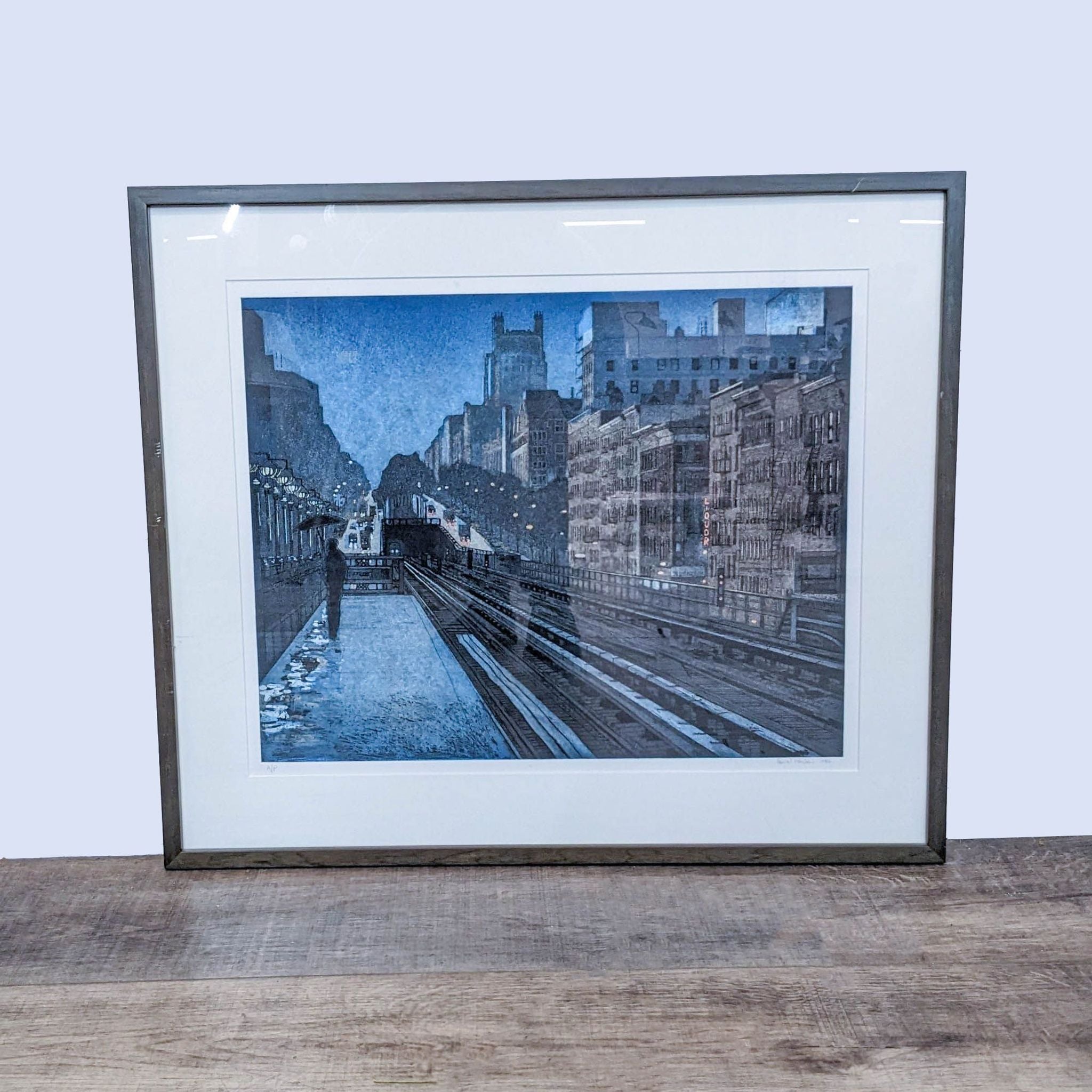 Framed print "Evening Rain" depicting a rain-slicked subway platform at twilight, signed by Daniel Hauben.