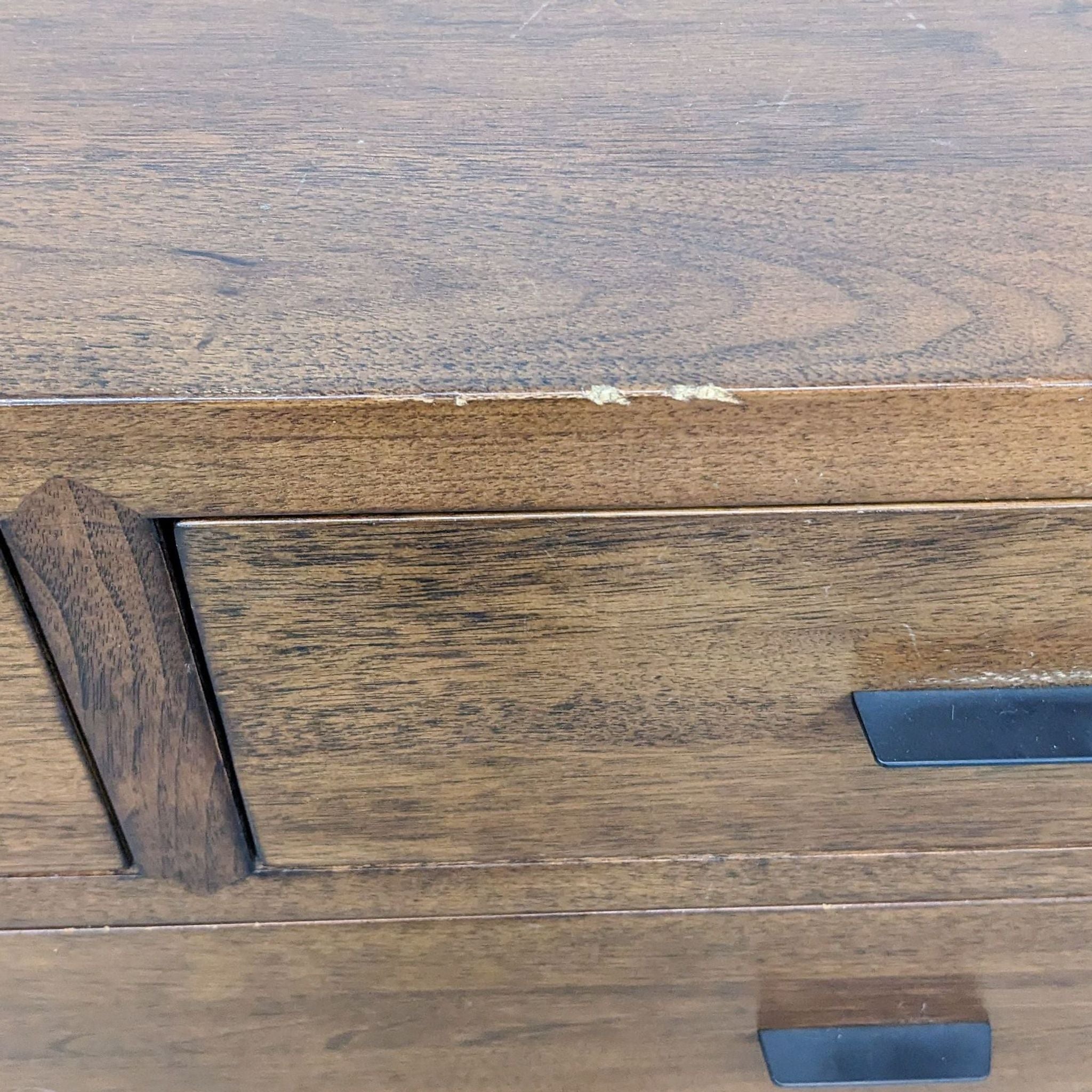 Close-up of a Room & Board Berkeley Dresser drawer with natural steel slab pull.