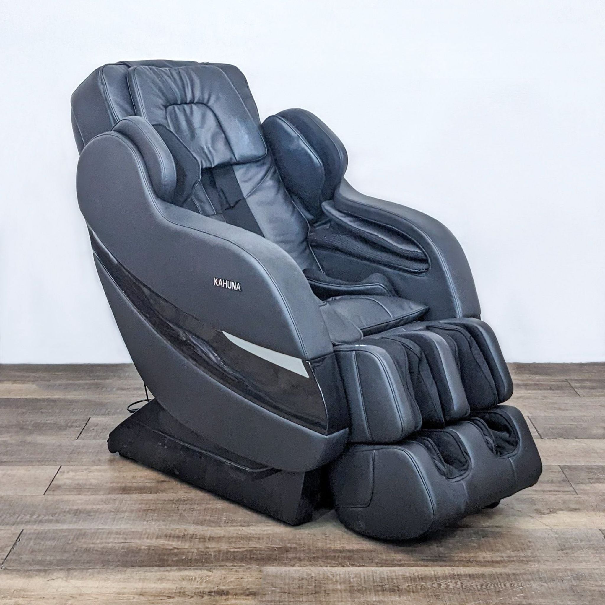 Kahuna SM-7300 full body massage chair with 9 auto programs, stretching, heat therapy, zero gravity, double leg extension, and space-saving design.
