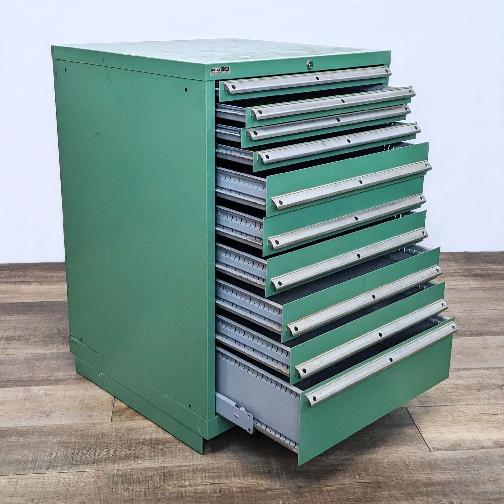 Alt text 2: Open drawers of a green Lista tool cabinet showing metal interiors, designed for easy-access tool storage and organization.