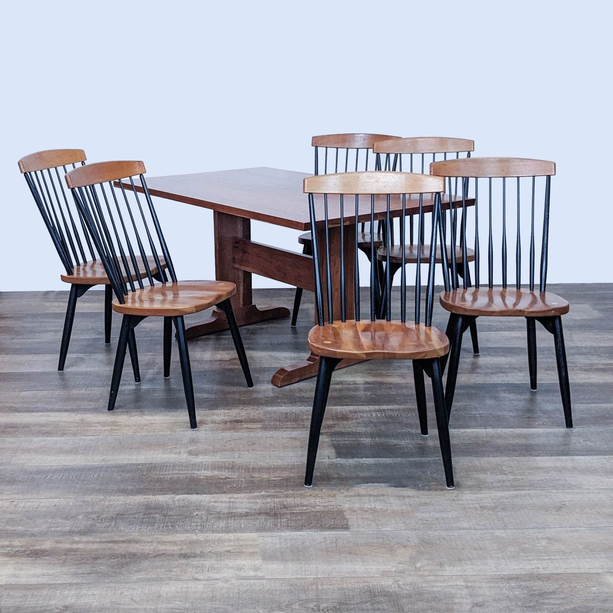 Contemporary W.A. Mitchell dining set with square table and six black spindle-back chairs with natural seats.
