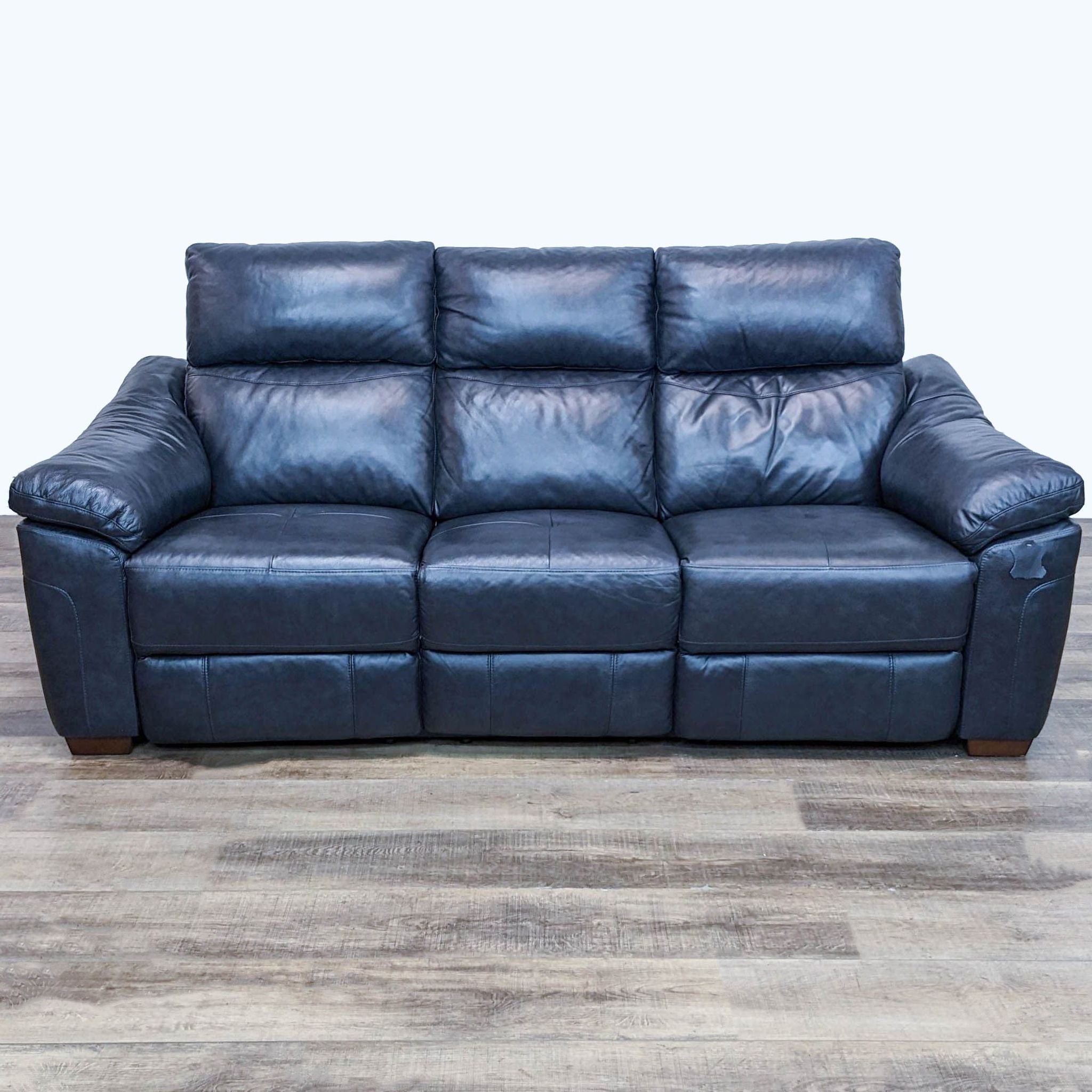 Reperch brand 3-seat sofa with high back lumbar support cushion and plush arms, presented on a wooden floor.