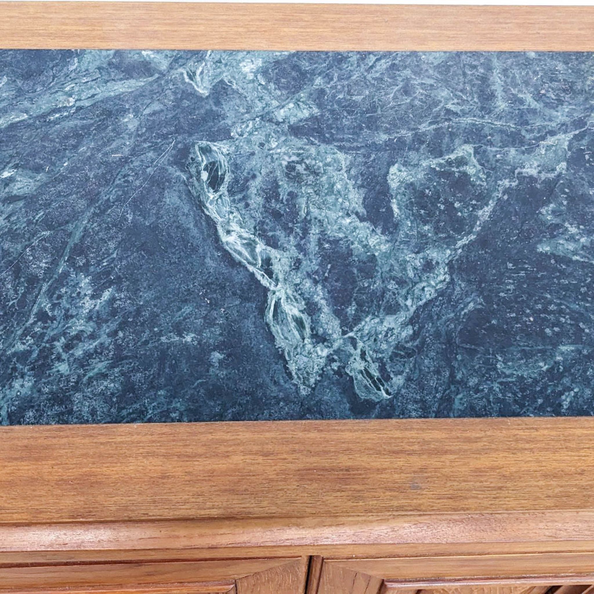 Close-up of Reperch sideboard's marble top with detailed texture.