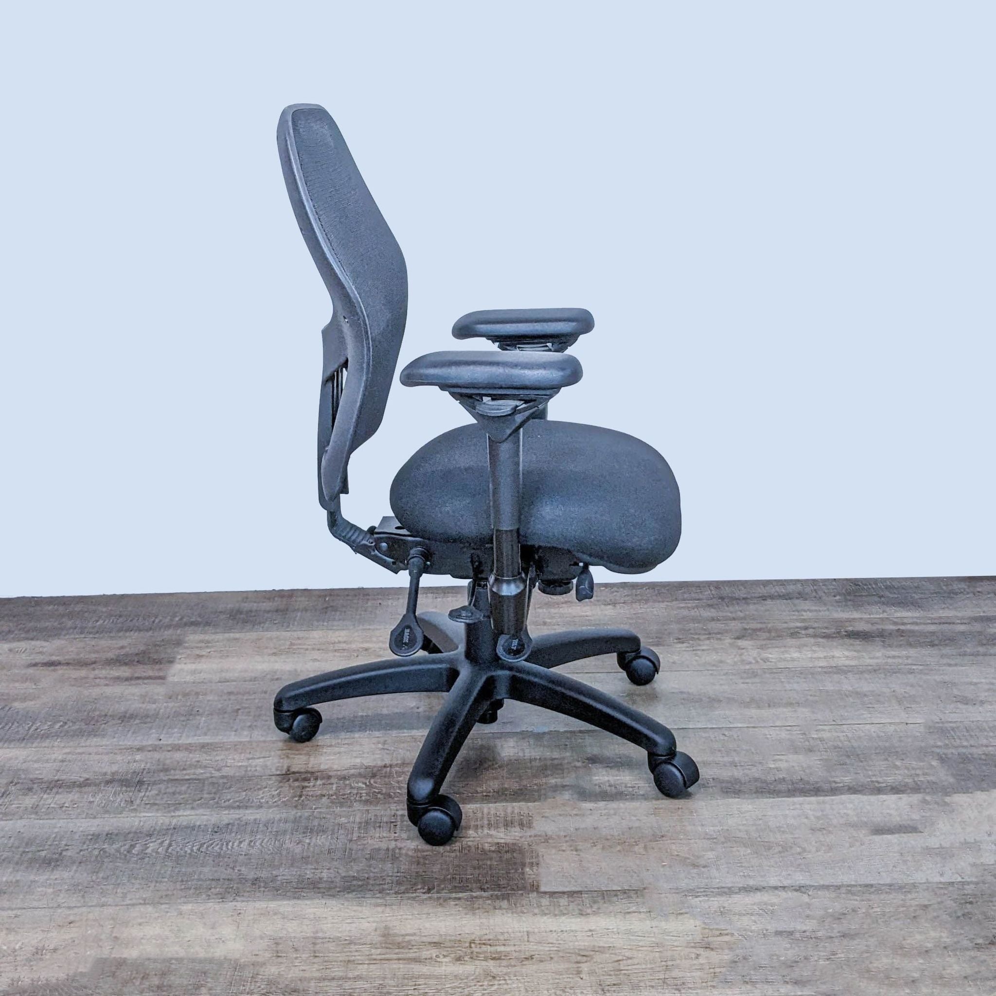 Ergonomic black Bodybilt chair with lumbar support and height-adjustable features, front and side views.