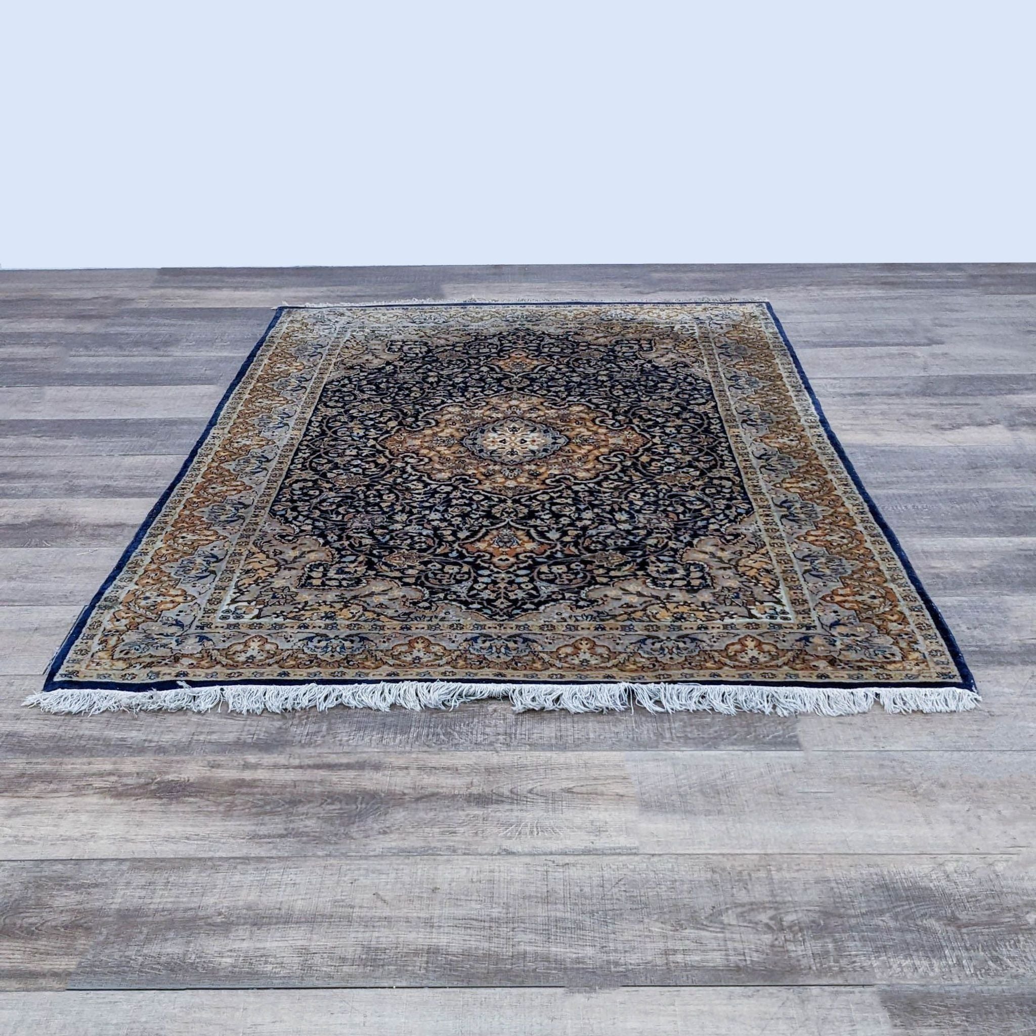 7' x 4.5' Reperch Oriental rug with intricate patterns and fringes on wooden floor.