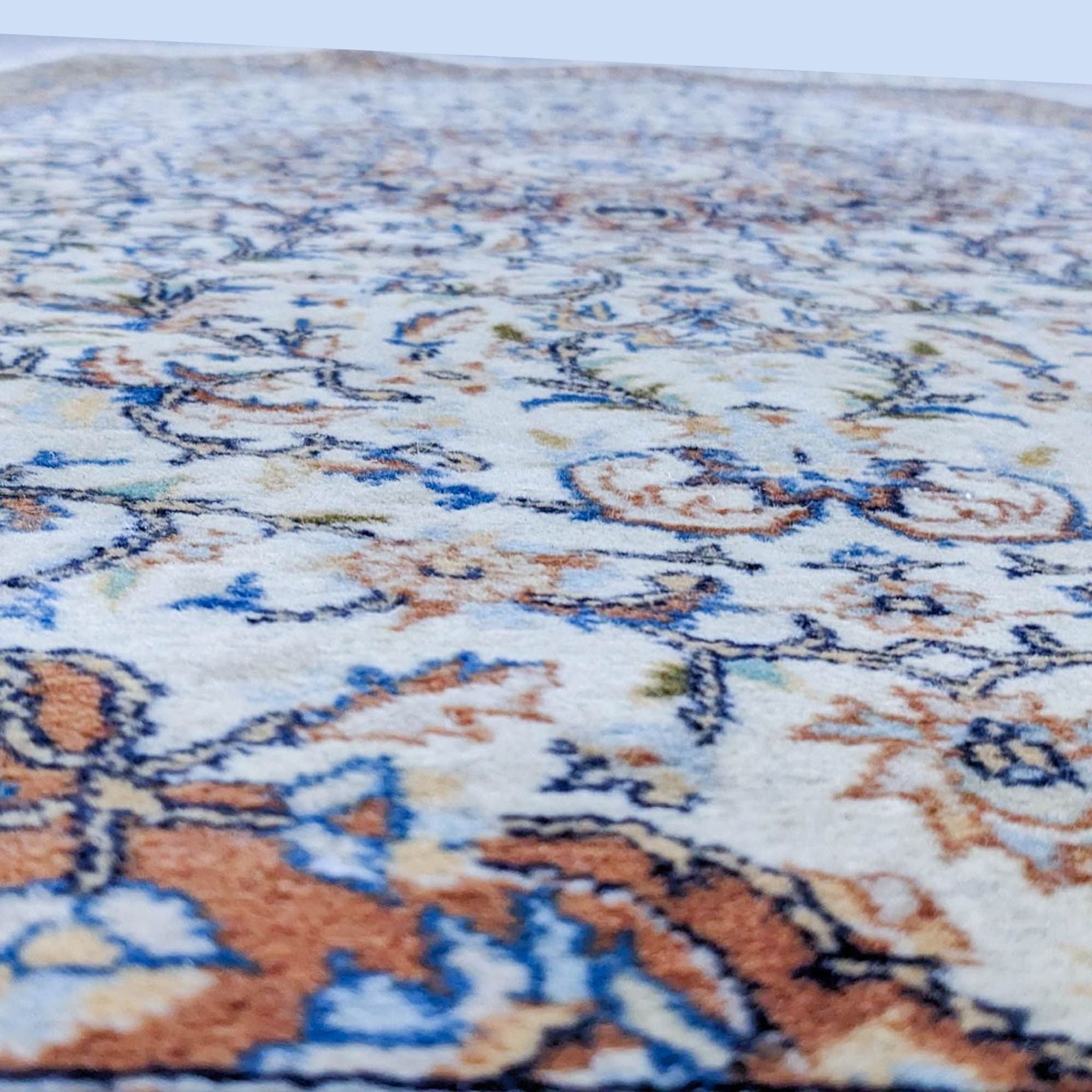 Close-up of a Reperch oriental rug showcasing intricate earth-tone designs and texture.