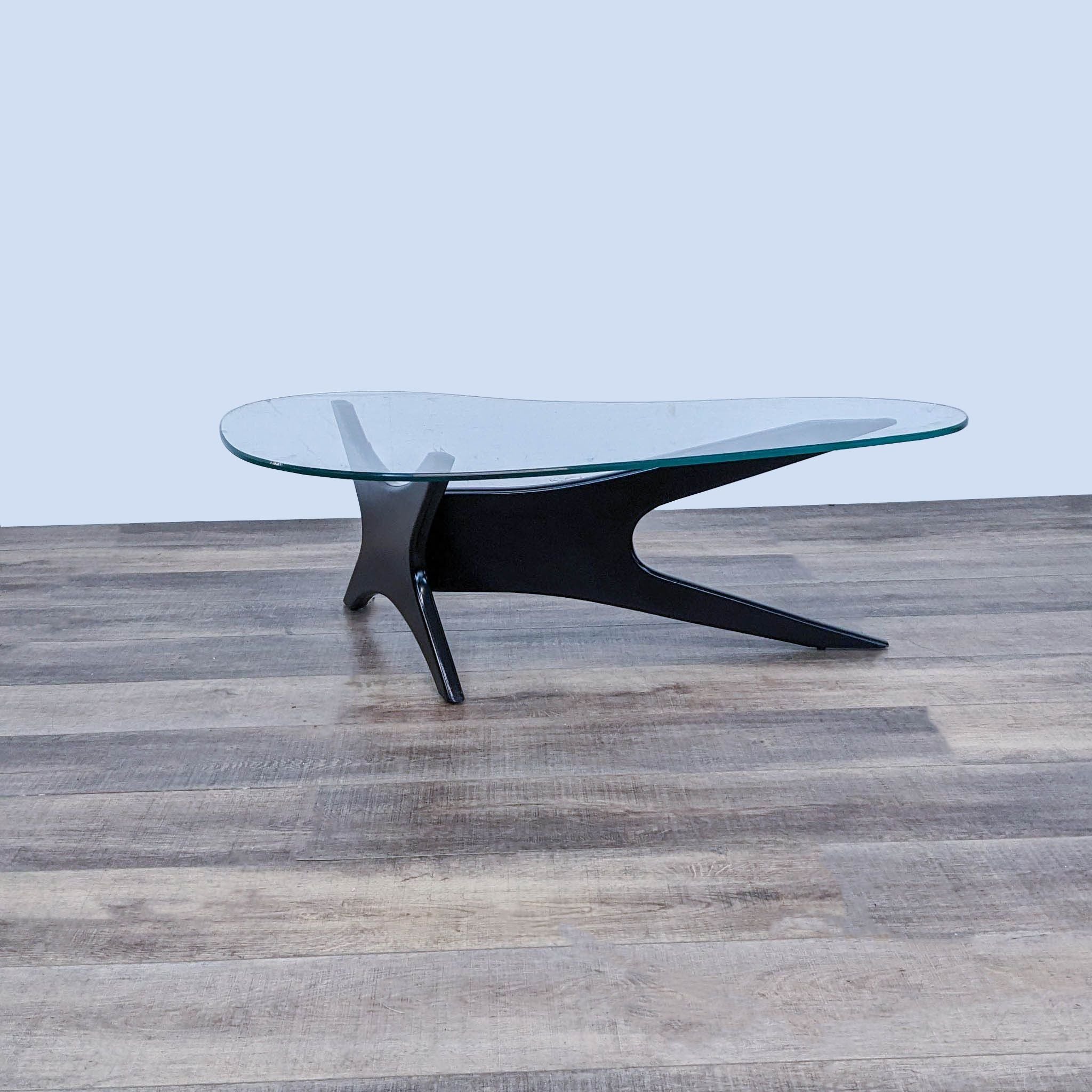 Reperch Mid-Century coffee table with glass top and three-legged wooden base, showcasing Adrian Pearsall style.