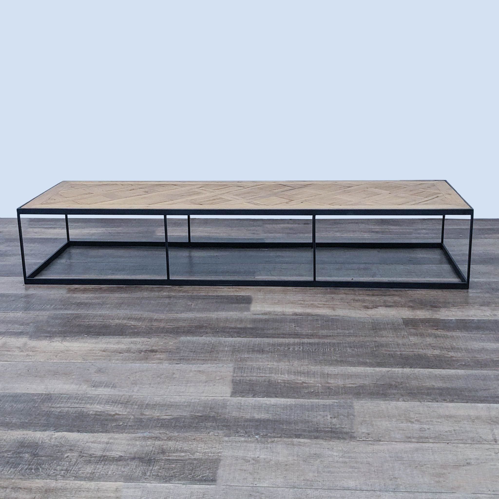 Reperch brand coffee table with a metal frame and patterned wooden top on a gray floor.