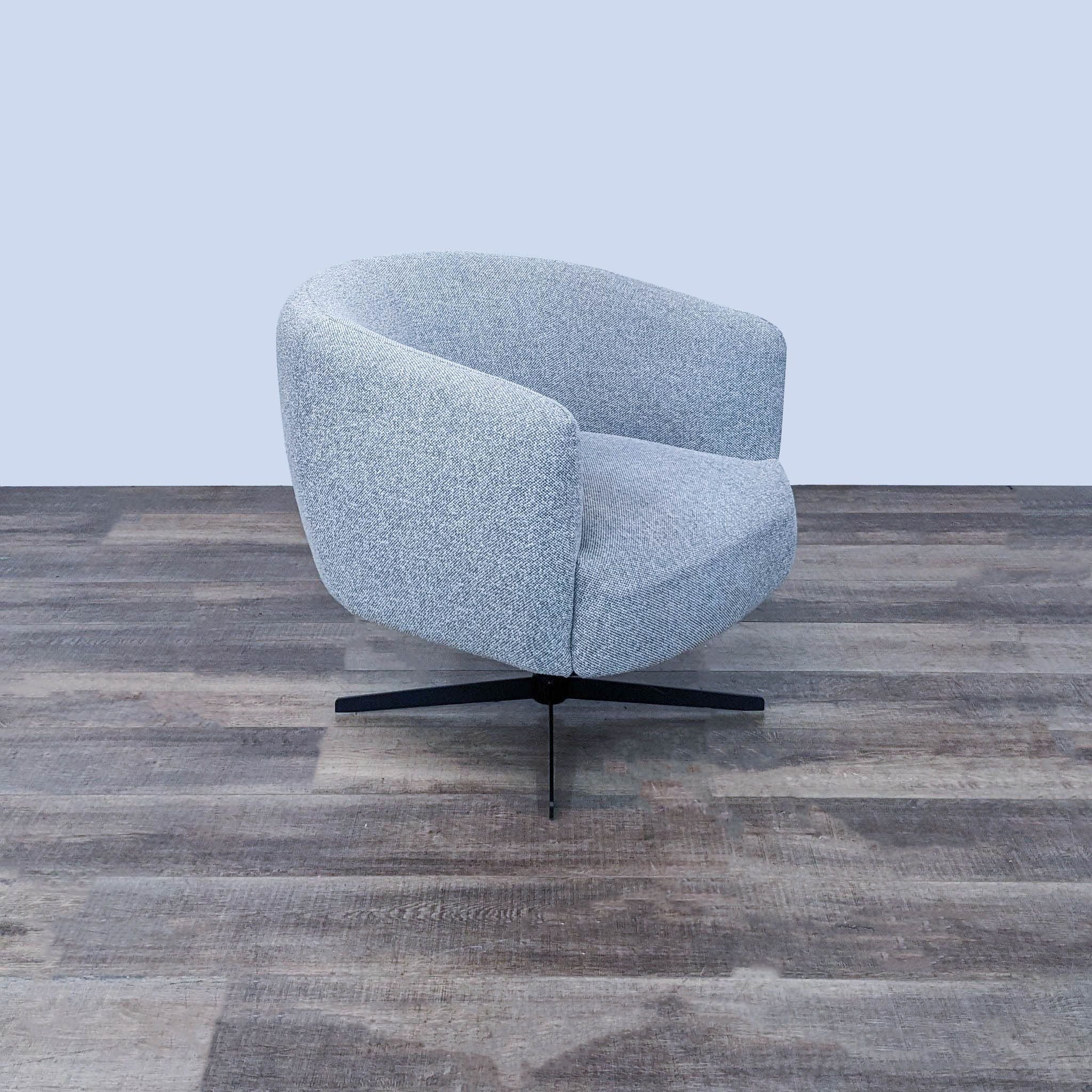 Contemporary Target swivel lounge chair with textured light grey chenille fabric and a sturdy metal base.
