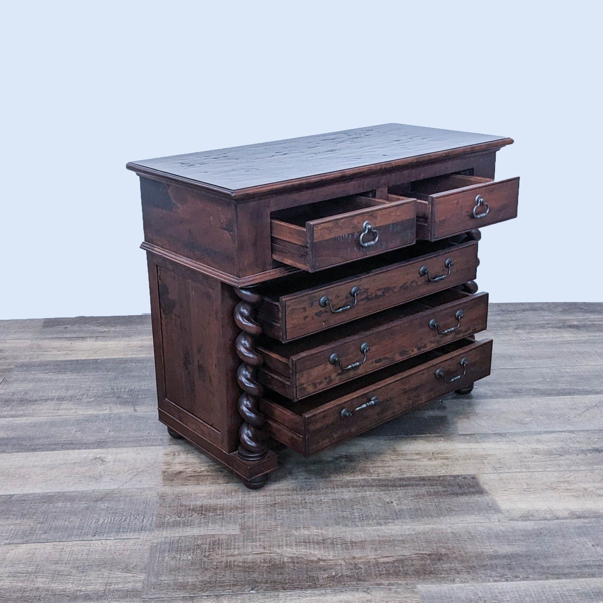 Alt text 2: Open view of a dark wood Reperch dresser showcasing Barley Twist detailing and five partially open drawers.