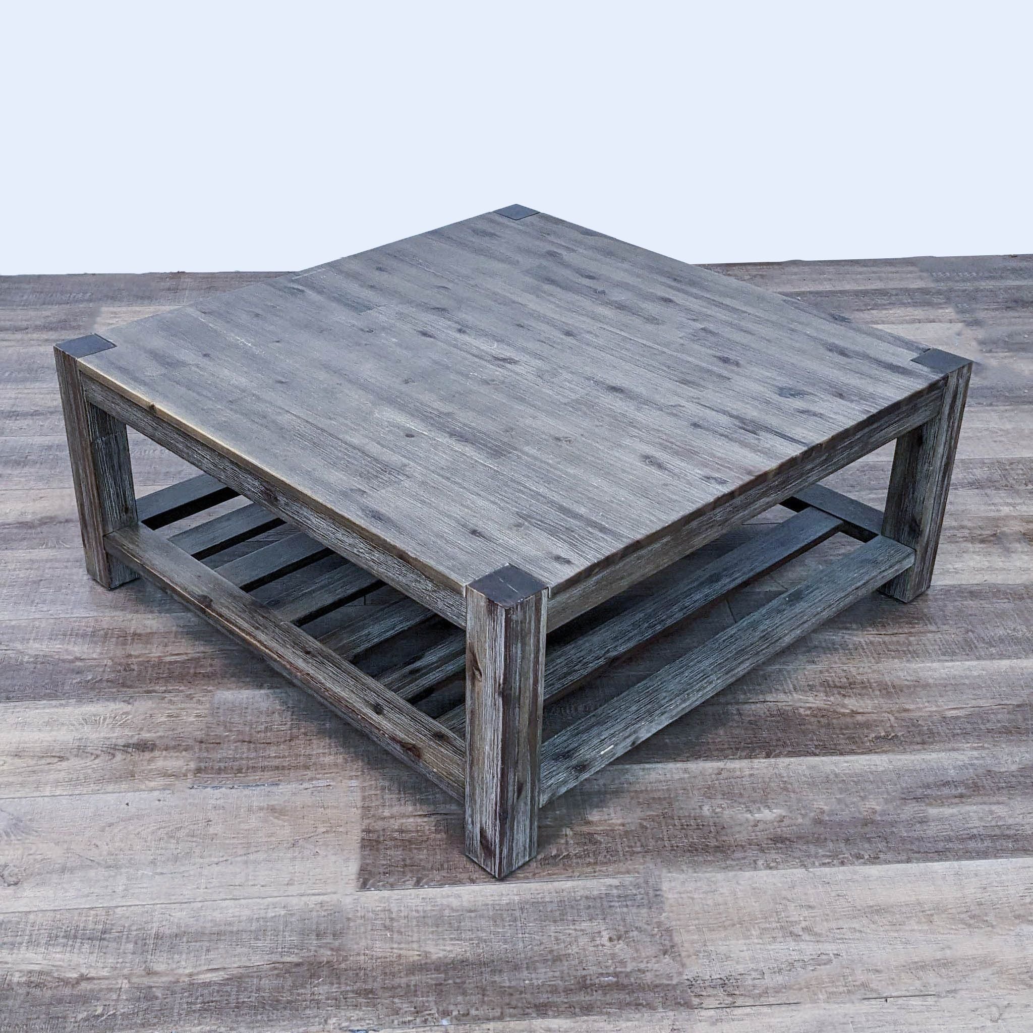 Distressed taupe wire-brushed finish coffee table with slatted shelf by Macy's Furniture Gallery.