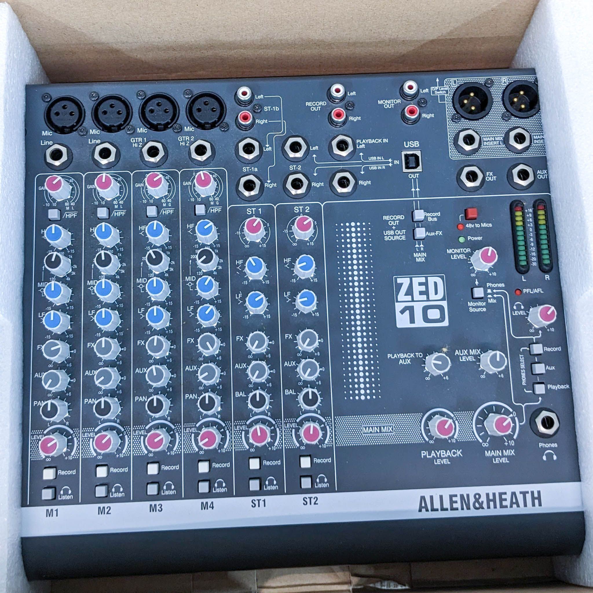 Allen & Heath ZED-10 mixer with USB, packed in styrofoam, view of control surface with knobs and connections.