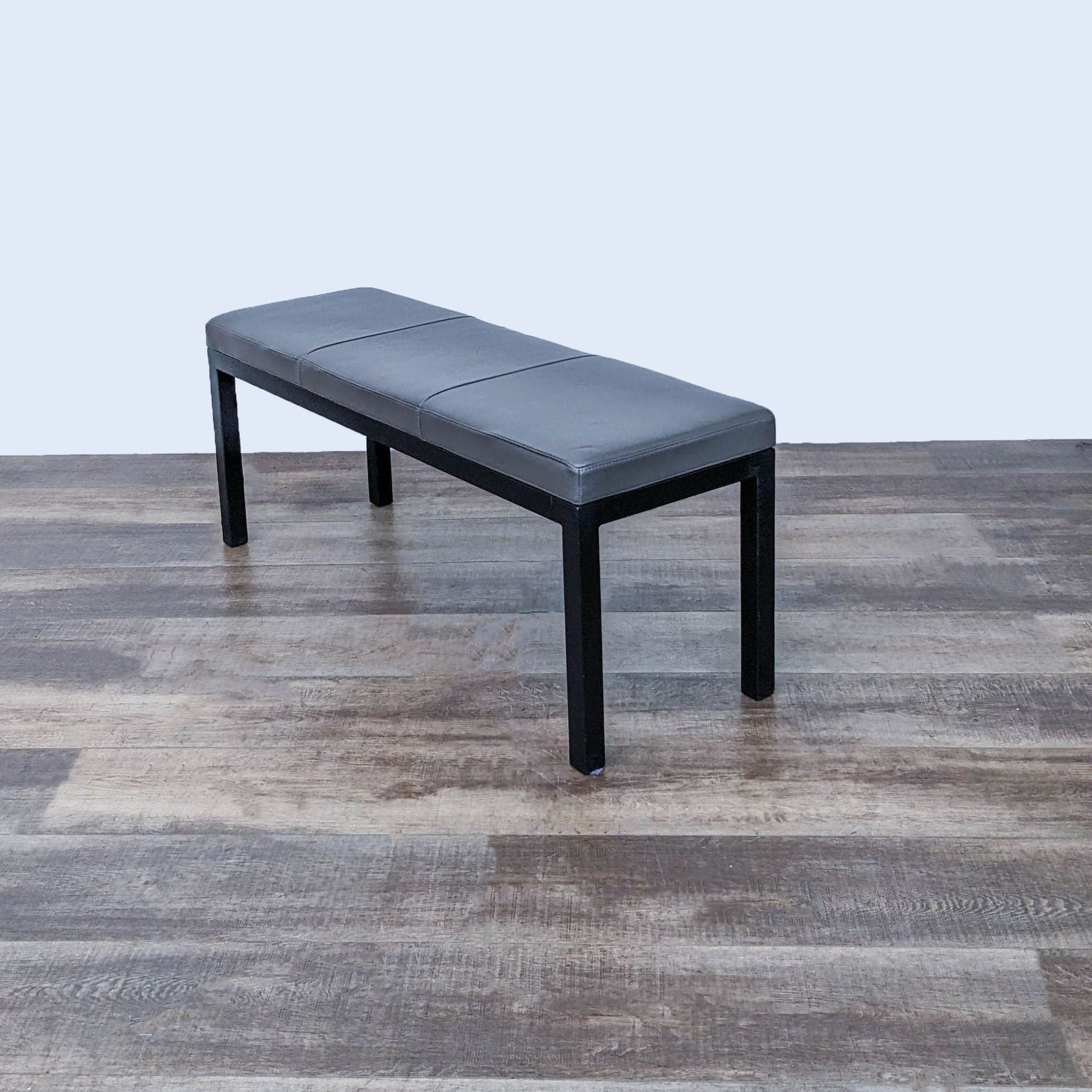 Sturdy Reperch bench featuring a simple design with a comfortable padded top.