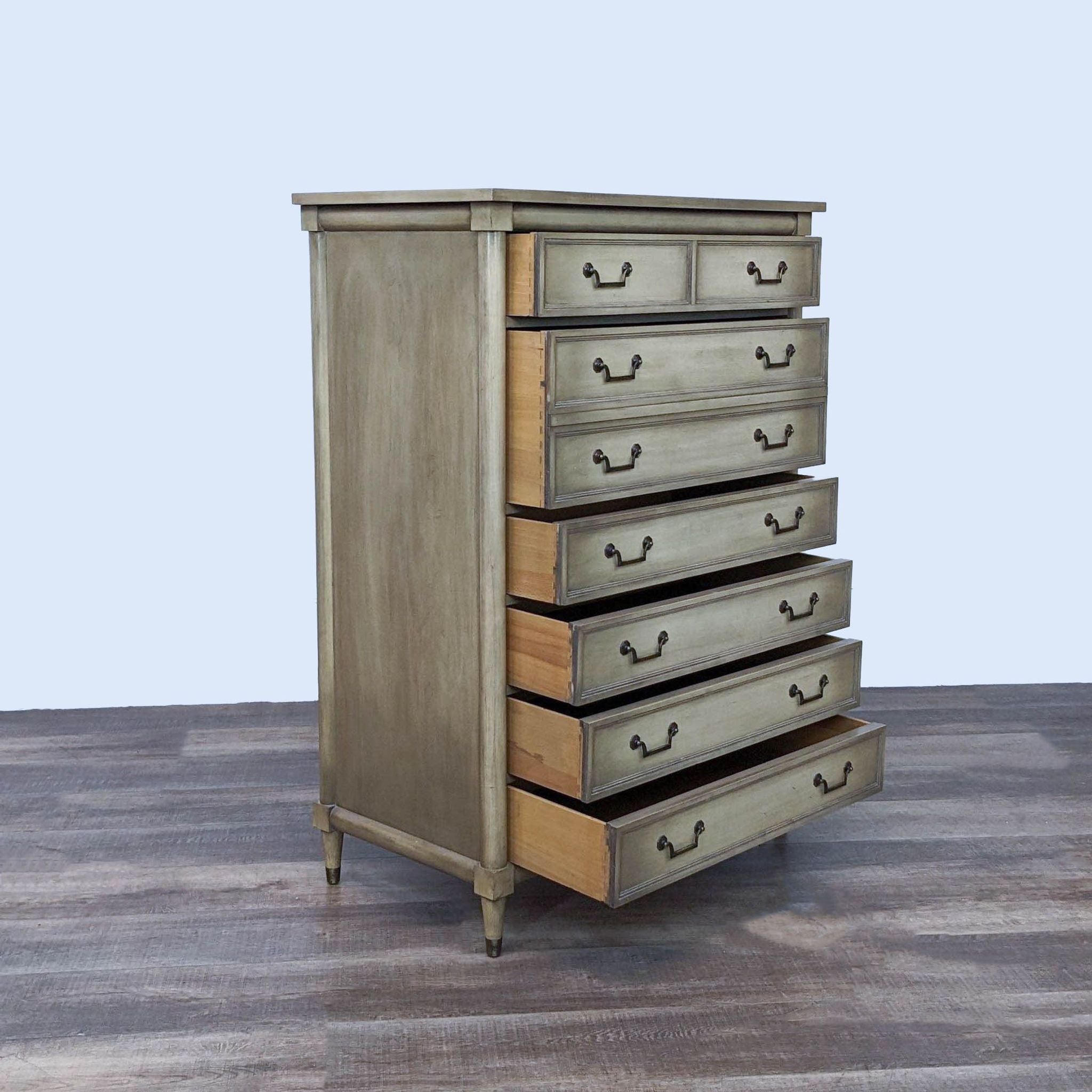 Alt text 2: Open drawer view of a classic Reperch wooden dresser, showcasing its spacious storage and rustic finish on a wooden floor.